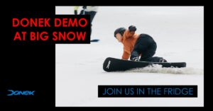 snowboarder on her front side edge at Big Snow